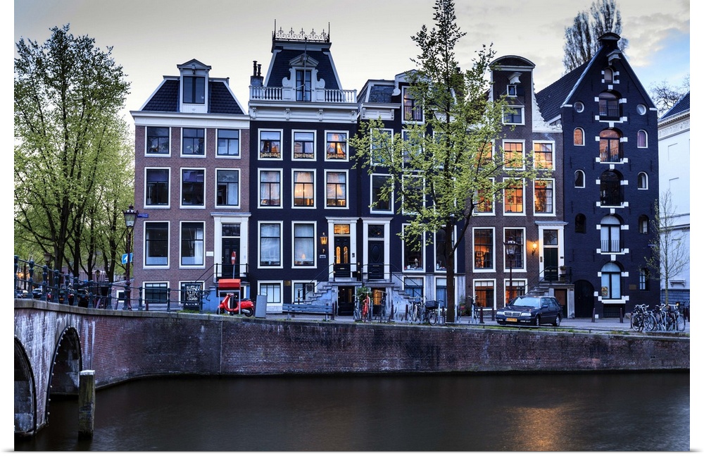 Old gabled houses line the Keizersgracht canal at dusk, Amsterdam, Netherlands, Europe.