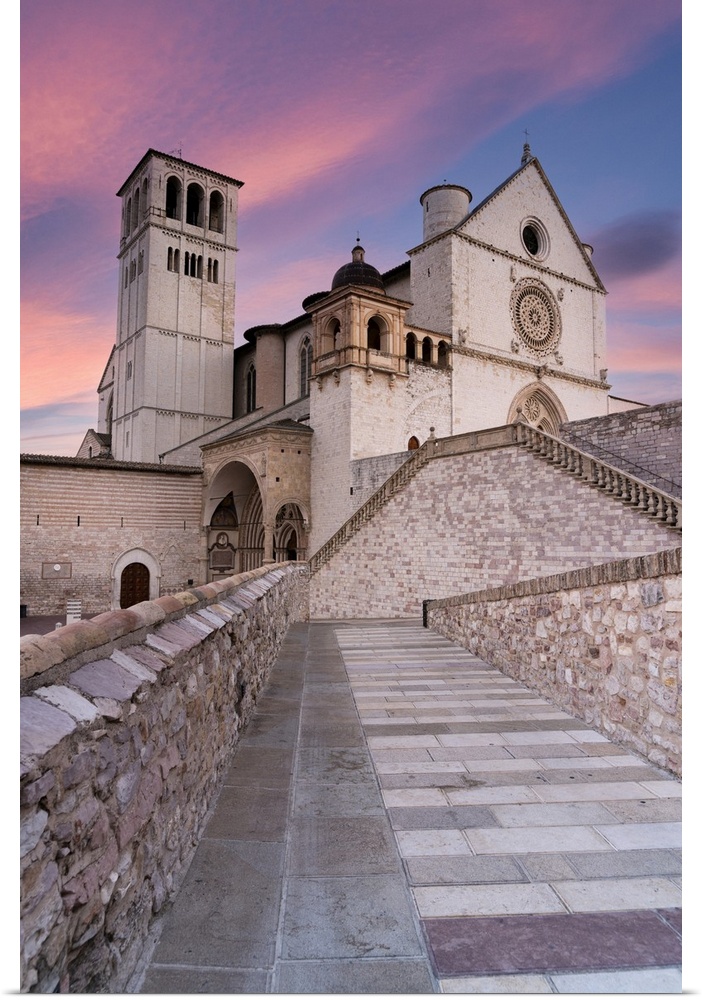 Pink sunrise over the Papal Basilica of Saint Francis in Assisi, UNESCO World Heritage Site, Perugia province, Umbria, Ita...