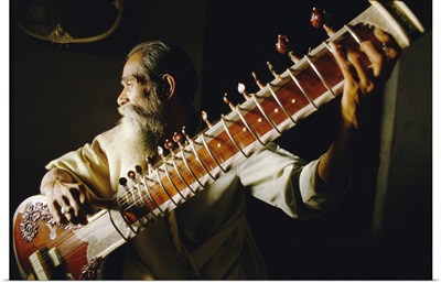 Portrait Of An Elderly Man Playing The Sitar, India