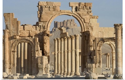 Qala'at ibn Maan castle seen through monumental arch, Palmyra, Syria