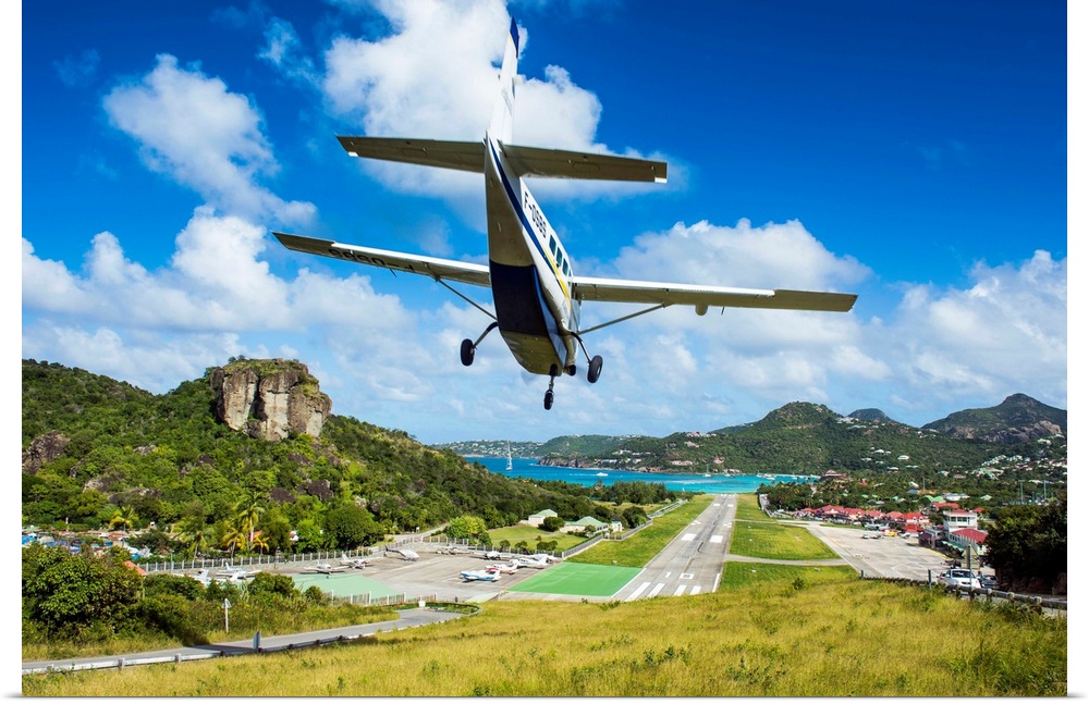 Small airplane landing at the airport of St. Barth, Lesser Antilles, West Indies, Caribbean