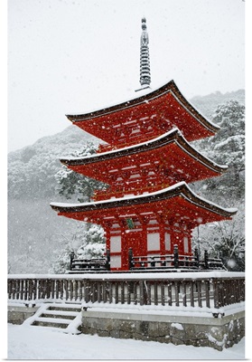 Snow falling on small red pagoda, Kiyomizu-dera Temple, Kyoto, Japan