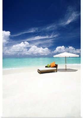 Sofa and parasol on tropical beach, The Maldives, Indian Ocean, Asia