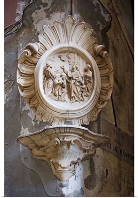 St. Vincent Ferrerio stone carving in the old town, Genoa, Liguria, Italy