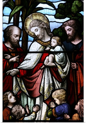 Stained glass window depicting Jesus welcoming children, Sussex, England, UK