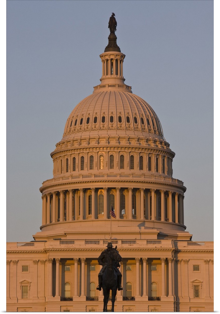Statue in front of the dome of the U.S. Capitol Building, evening light, Washington D.C