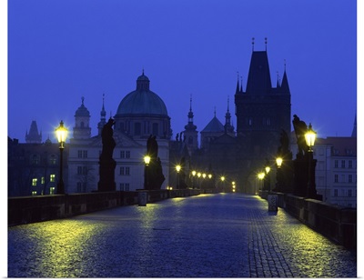 The Charles Bridge at night and city skyline with spires, Prague, Czech Republic
