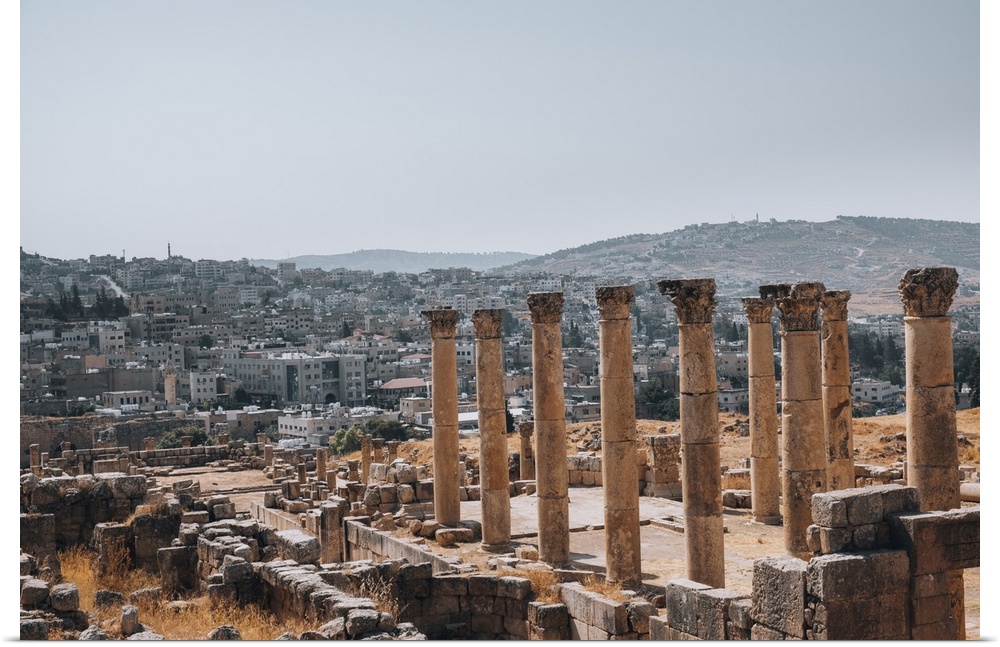 The ruins of a Roman temple, with the modern city of Jerash in the background, Jerash, Jordan, Middle East