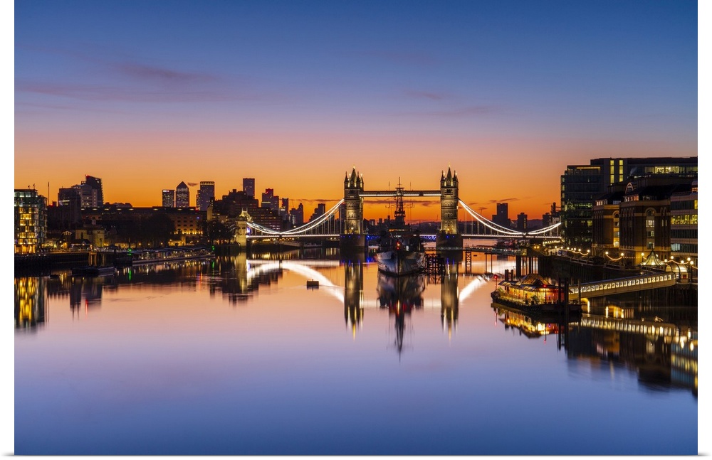 Tower Bridge, HMS Belfast and reflections in a still River Thames at sunrise, London, England, United Kingdom, Europe