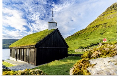 Traditional Church With Grass Roof Overlooking The Fjord, Faroe Islands, Denmark