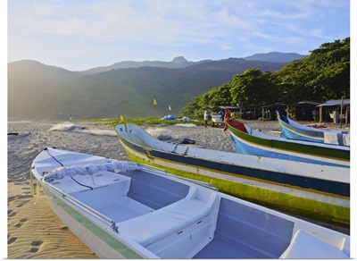 Traditional colourful boats on the beach in Bonete, Ilhabela Island, Brazil