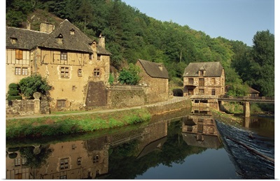 Tranquil scene of reflections in water of a millhouse, Midi-Pyrenees, France