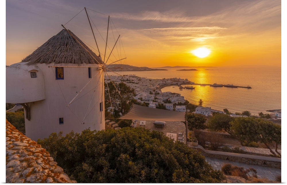 View of windmill overlooking town at golden sunset, Mykonos Town, Mykonos, Cyclades Islands, Greek Islands, Greece, Europe