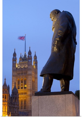 Winston Churchill statue and Parliament at night, London, England, UK