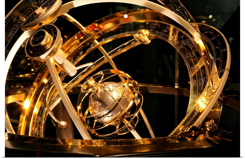 Armillary sphere. This astronomical device shows the circles of the celestial sphere surrounding the Earth (centre). The m...