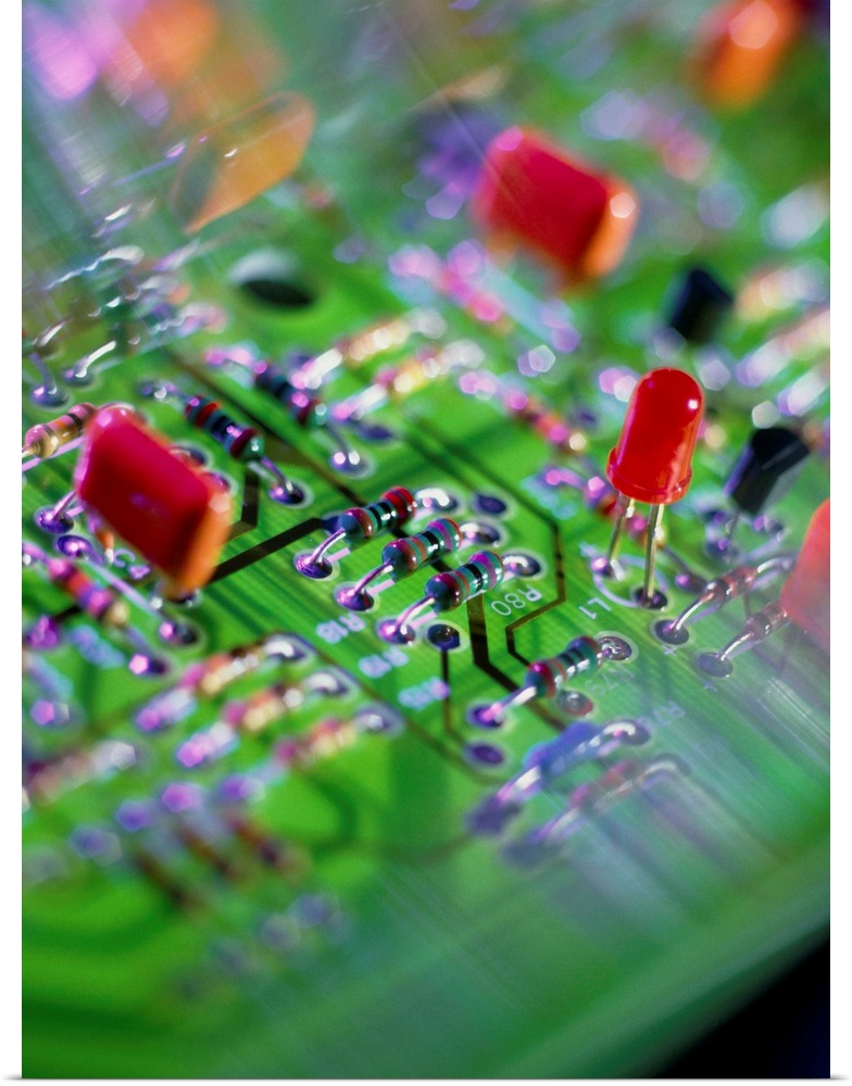 Circuit board. Close-up view of an electronic circuit board, showing resistors (centre), a Light Emitting Diode (LED, cent...