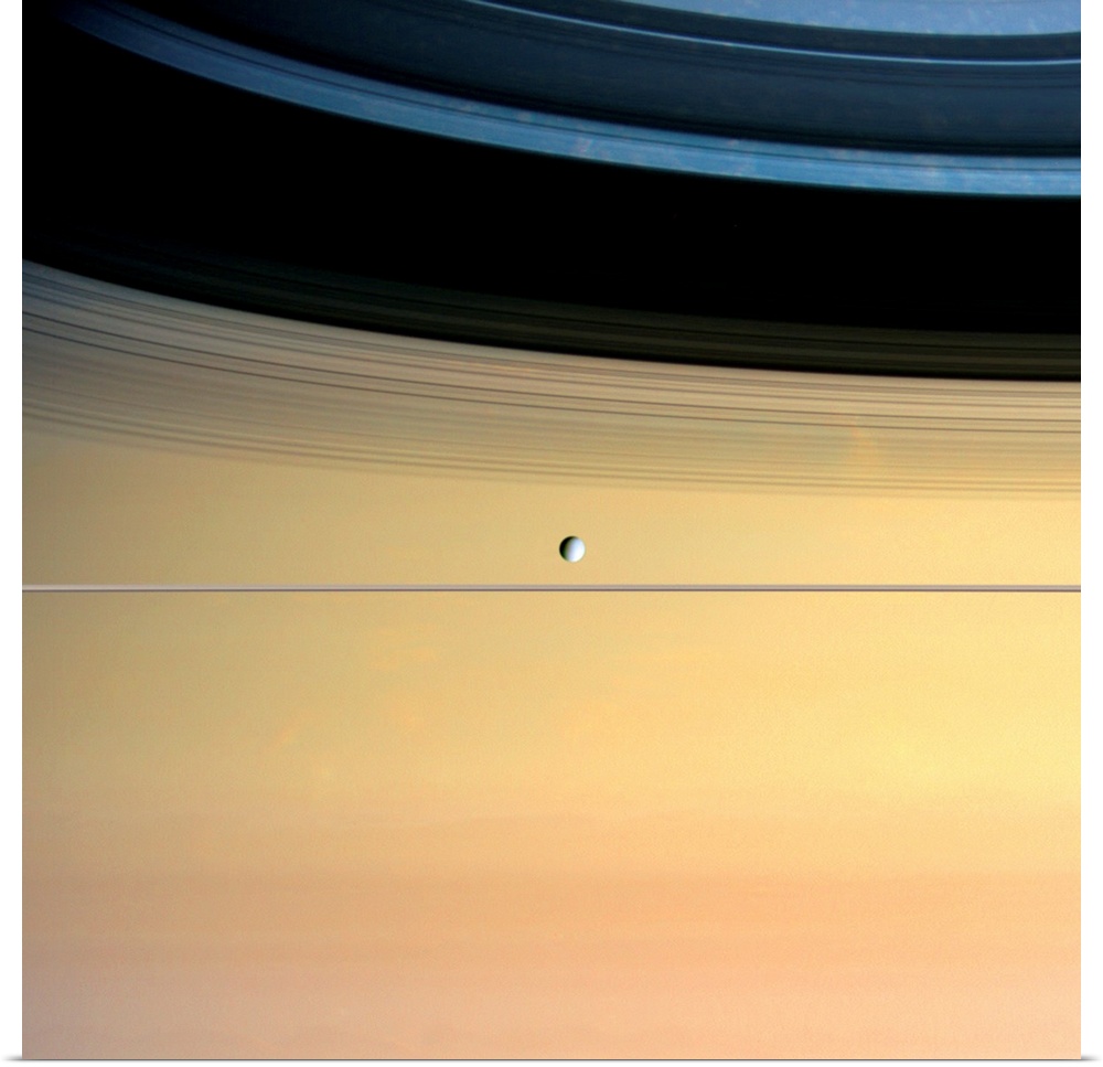 Dione and ring shadows on Saturn, Cassini image. Dione is around 1123 kilometres in diameter and orbits some 377,000 kilom...
