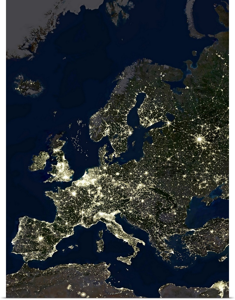 Europe at night, satellite image. City lights (yellow) of increasing intensity show areas of increasing population, with a...
