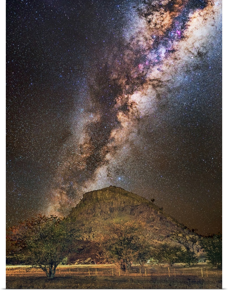 Milky Way over a mountain, Namibia. The Milky Way is our galaxy seen from the inside, forming a band of stars and nebulae ...