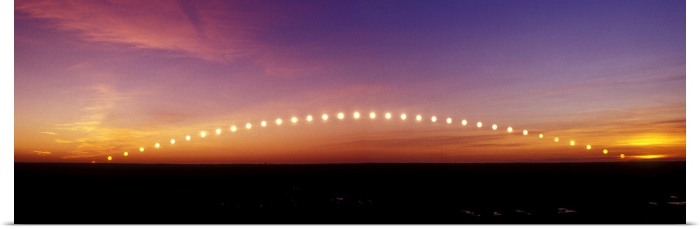 Time-lapse image of a suntrail. Time-lapse exposure showing the path of the sun as it rises from below the horizon and the...