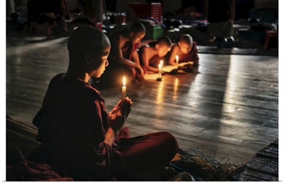 Burmese Monks Reading By Candlelight In Their Monastery