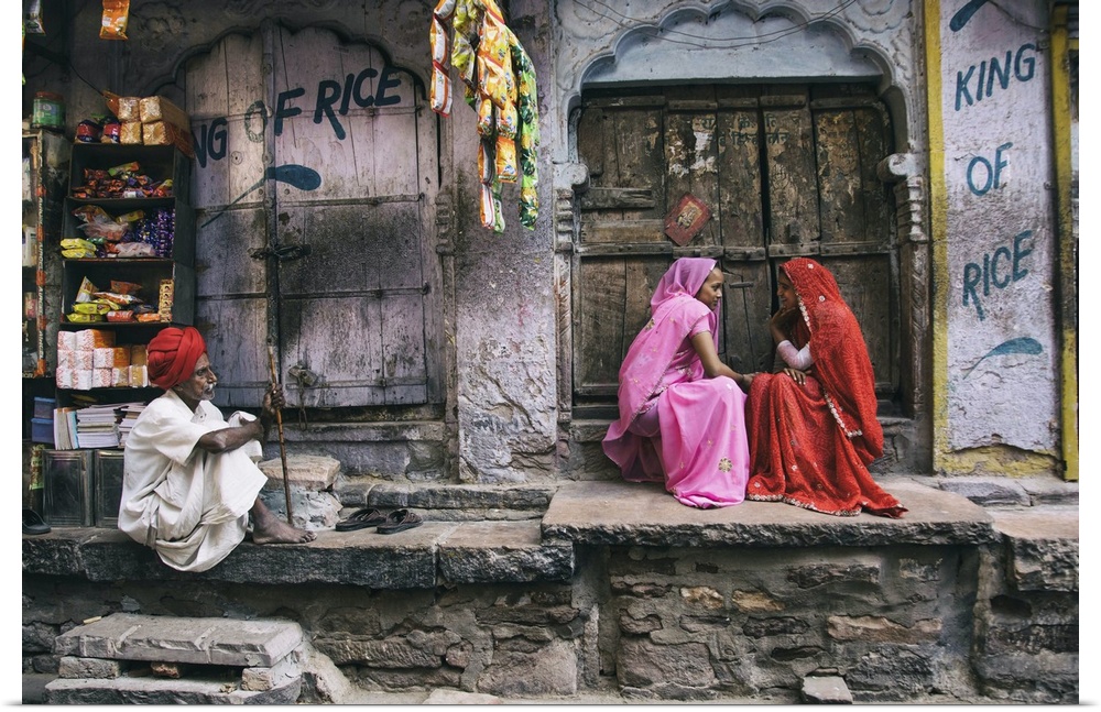 Colorful woman and man with turban in the Blue City of Jodhour, India.