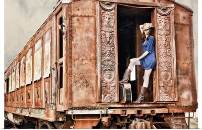 Cowgirl with luggage, hopping the train