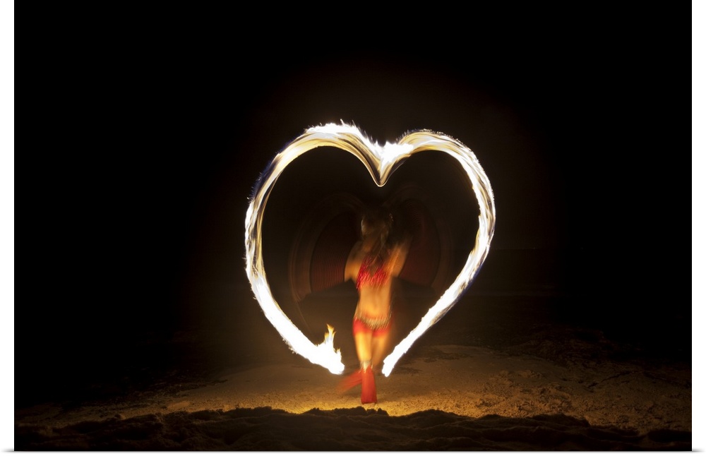 Firedancer making a heart design on the beach, Playa Del Carmen, Mexico