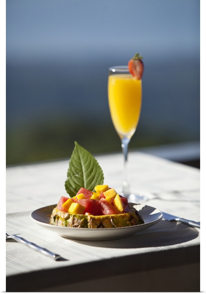 Fruit and a mimosa in a restaurant with a view of the ocean, Costa Rica