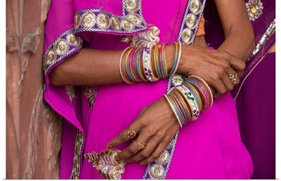 Jewelry on womans arms by the Taj Mahal in India