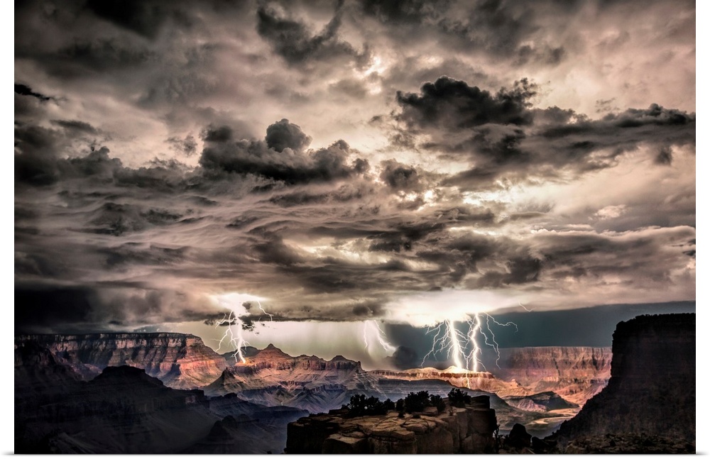 Photograph of lightning bolts striking gorge after sunset during a thunderstorm.