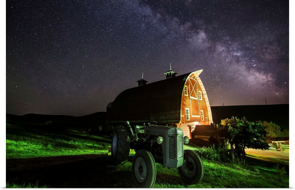 Milky Way over tractor and red barn in the Palouse.