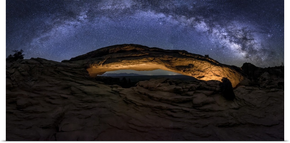 Milky Way panorama over Mesa Arch in Canyondlands National Park.
