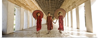 Monks with parasols in Mandalay, Burma