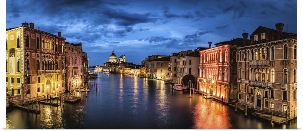 Panorama from the Academia Bridge after dark in Venice, Italy.