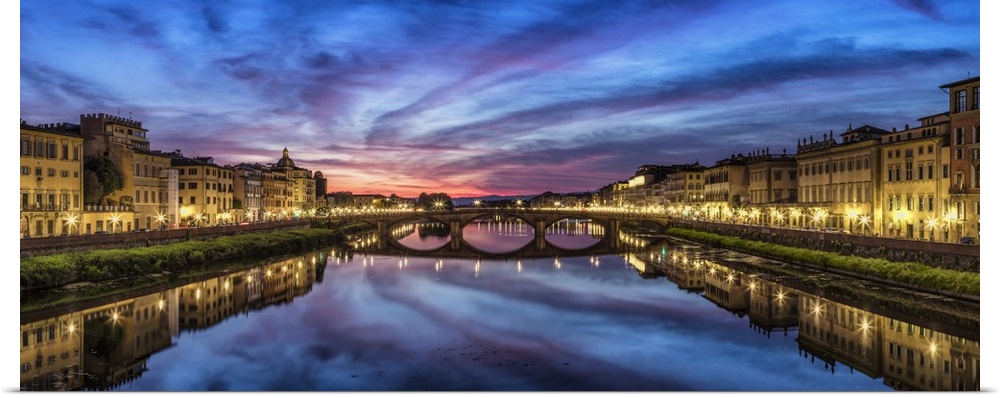Panorama over the Arno River at sunset in Florence, Italy