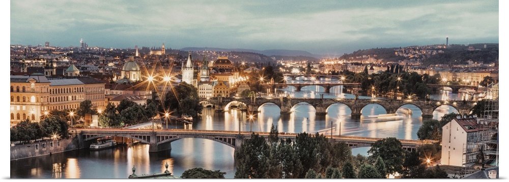 Panorama of Vltava River and bridges in Prague at sunset.