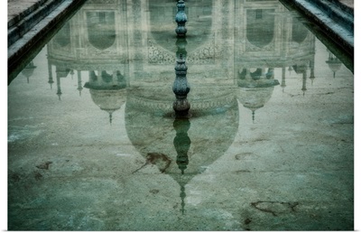 Reflection of the Taj Mahal in one of the pools