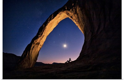Silhouette Of A Woman Under Corona Arch In Moab, Utah