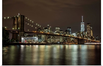 The Brooklyn Bridge and view of NYC after dark