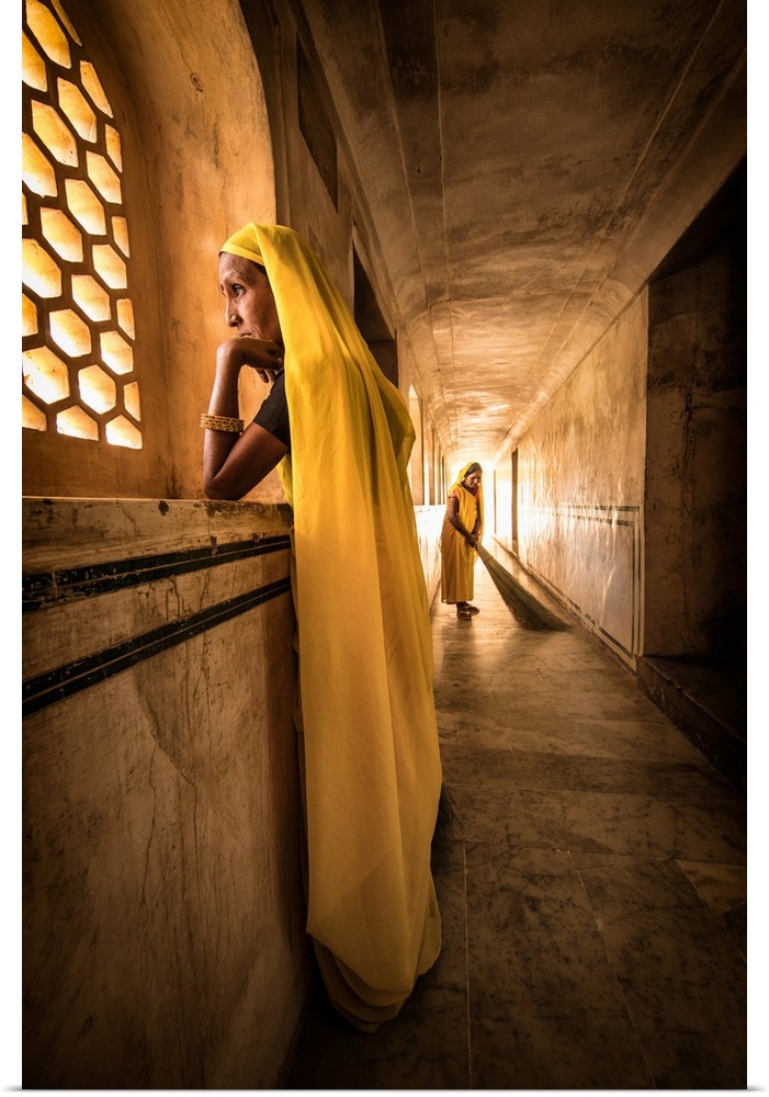 The Yellow sweepers of Amber Fort in Jaipur, Rajisthan, India.