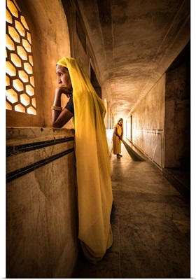The Yellow sweepers of Amber Fort in Jaipur, Rajisthan, India