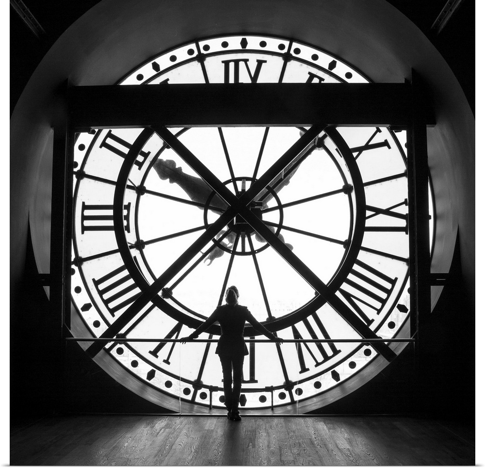 Woman by the clock inside the Musee D'Orsay in Paris