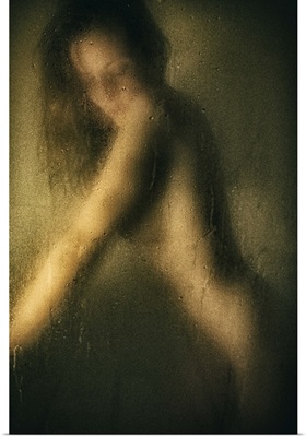 Woman leaning on hands in the shower
