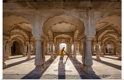 Woman sweeping in the Amber Fort in Jaipur, India