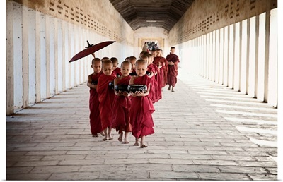 Young monks walking in their monastery, Bagan, Burma