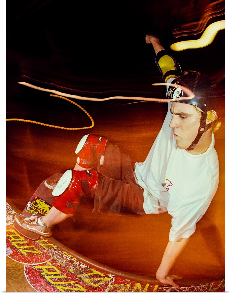 Jeff Grosso skateboarding on a railing with light trails, 1988.