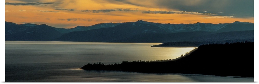 Panoramic view of Lake Tahoe at dusk with sunset light in the sky, California.