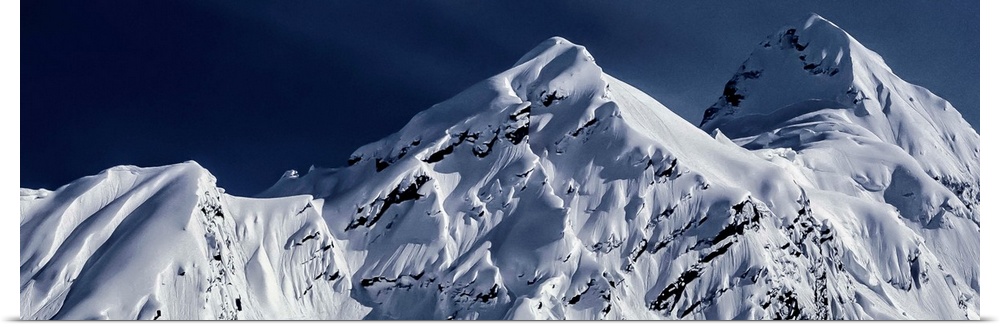 Snow-covered mountains of Pontoon Peak in the Chugach Range in Alaska.