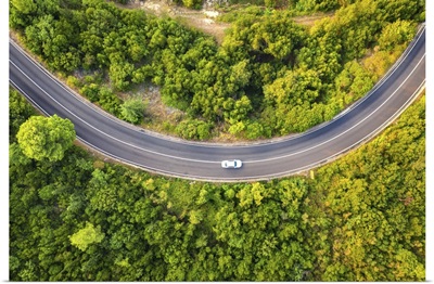 Aerial View Of Road With Car In Beautiful Forest At Sunset In Summer
